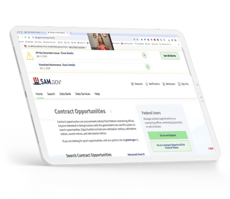 A laptop displaying a webpage from SAM.gov, highlighting contract opportunities with navigation links and search functionalities.